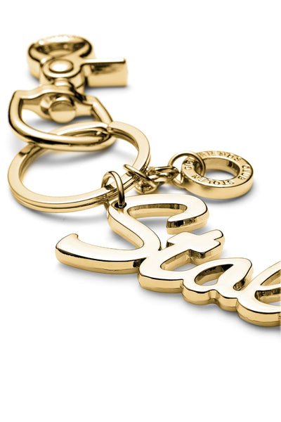 STOLEN  Script Keyring - GOLD ZINC ALLOY