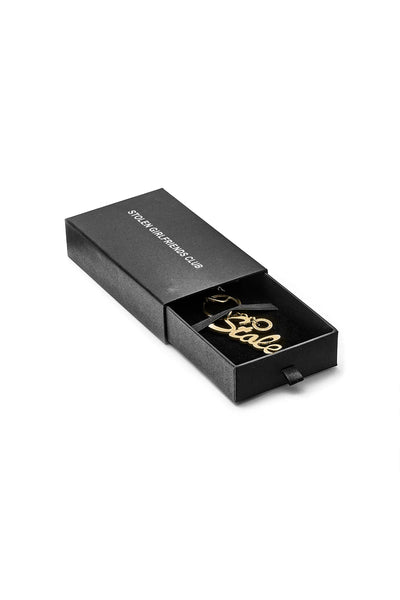 STOLEN  Script Keyring - GOLD ZINC ALLOY